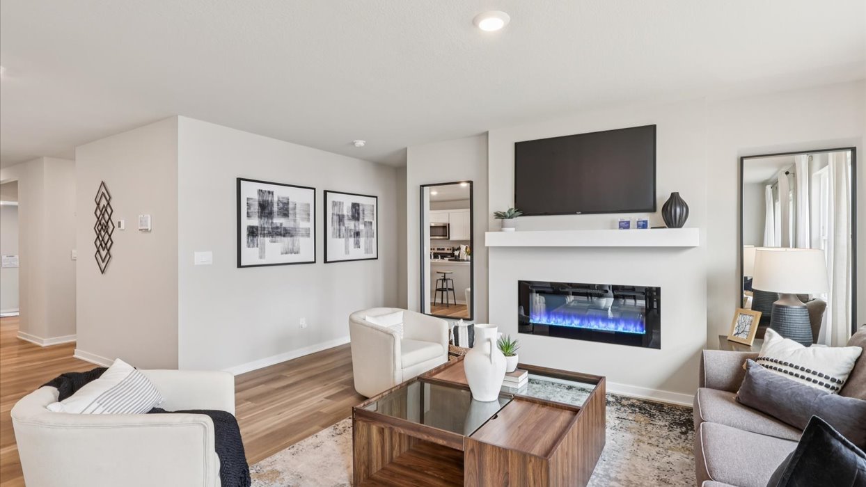 Open concept living room with electric fireplace