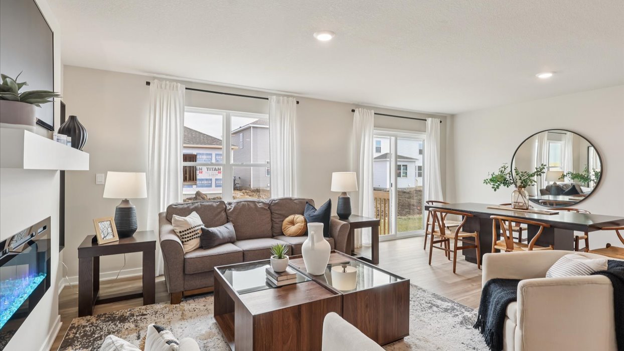 Open concept living room with electric fireplace