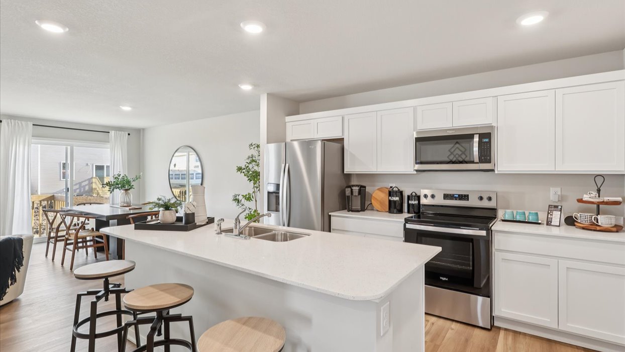 Kitchen with white cabinetry and quartz countertop