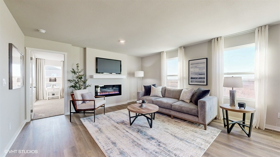 neuville living room with couch and fireplace