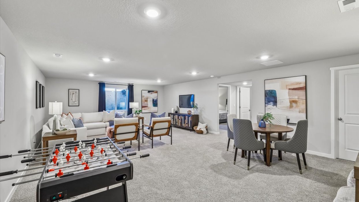 Finished basement living area with comfortable seating space and flexible room for entertaining or relaxing.