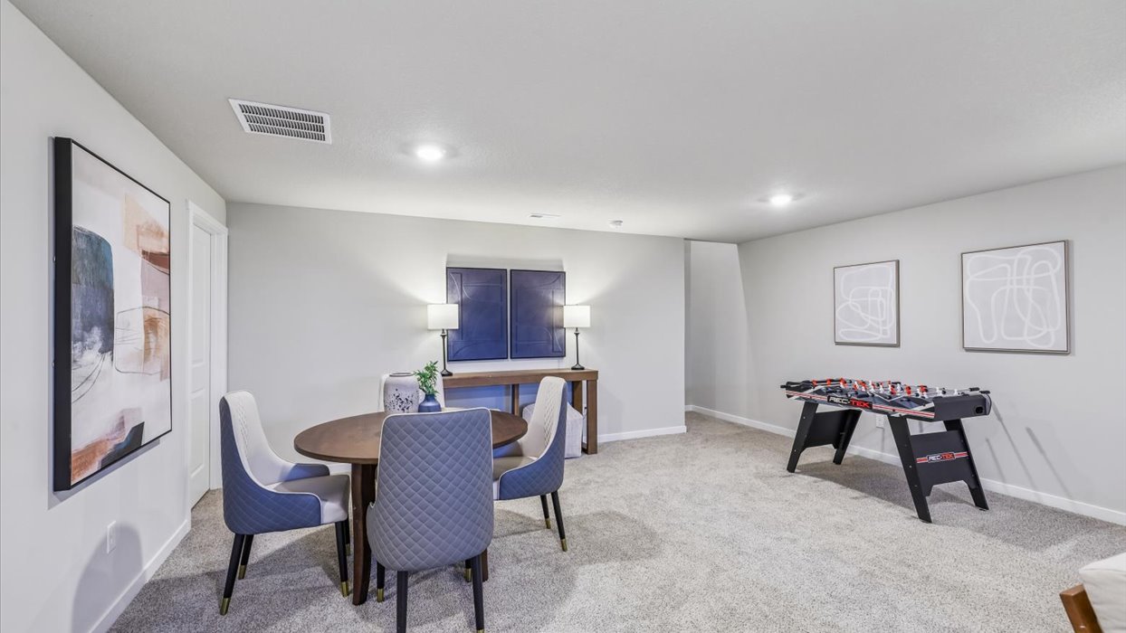 Finished basement living area with comfortable seating space and flexible room for entertaining or relaxing.