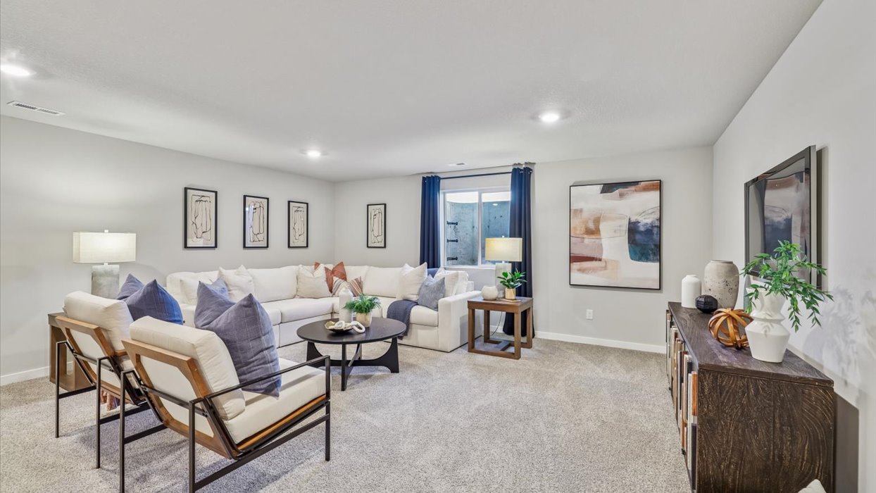 Finished basement living area with comfortable seating space and flexible room for entertaining or relaxing.