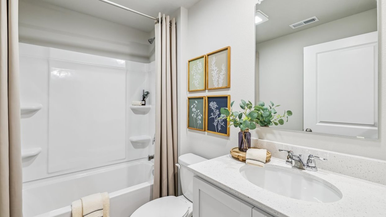 Stylish lower-level bathroom featuring contemporary fixtures and convenient access from the finished basement.