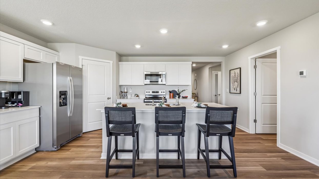 Kitchen with white cabinetry and quartz countertop