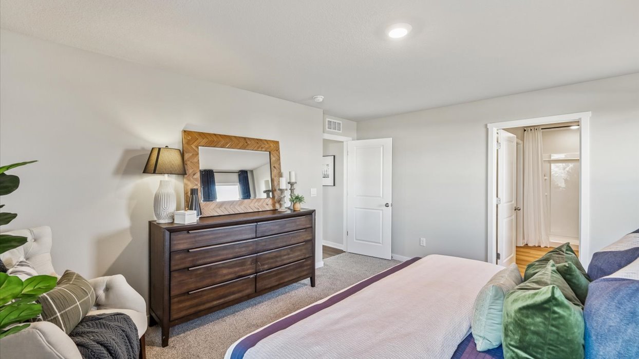 Primary bedroom with natural lighting and spacious layout