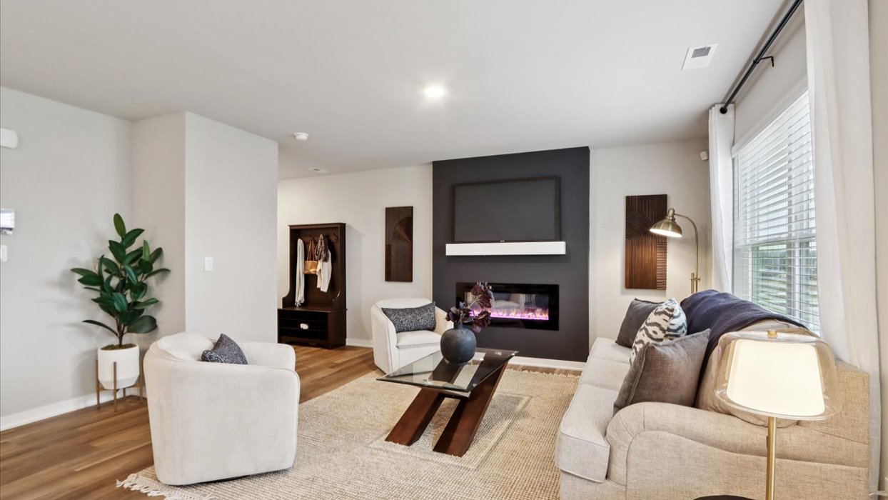 Open concept living room with electric fireplace