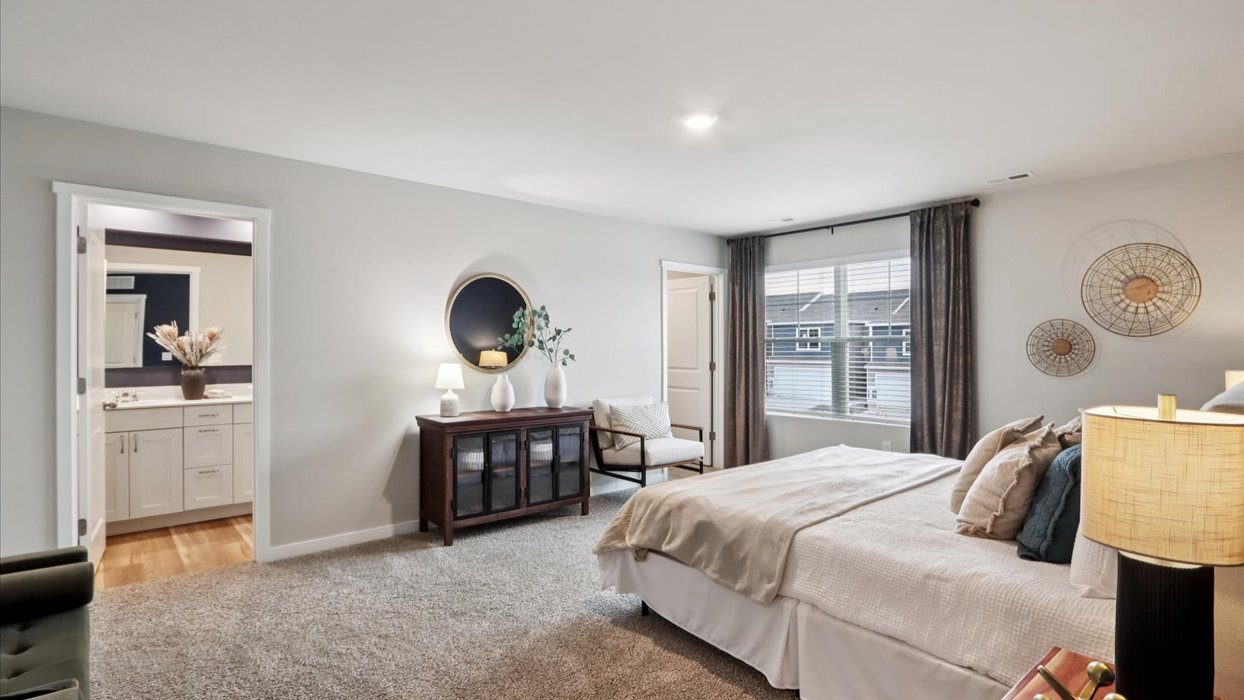 Primary bedroom with natural lighting and spacious layout