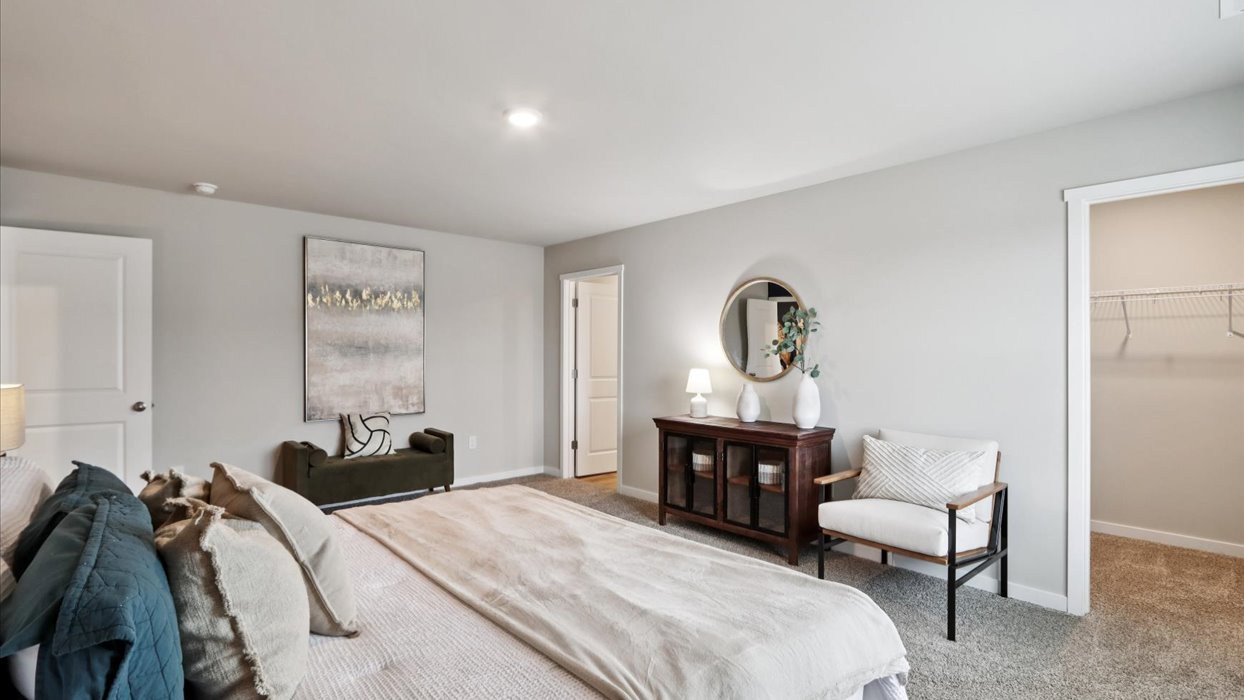 Primary bedroom with natural lighting and spacious layout