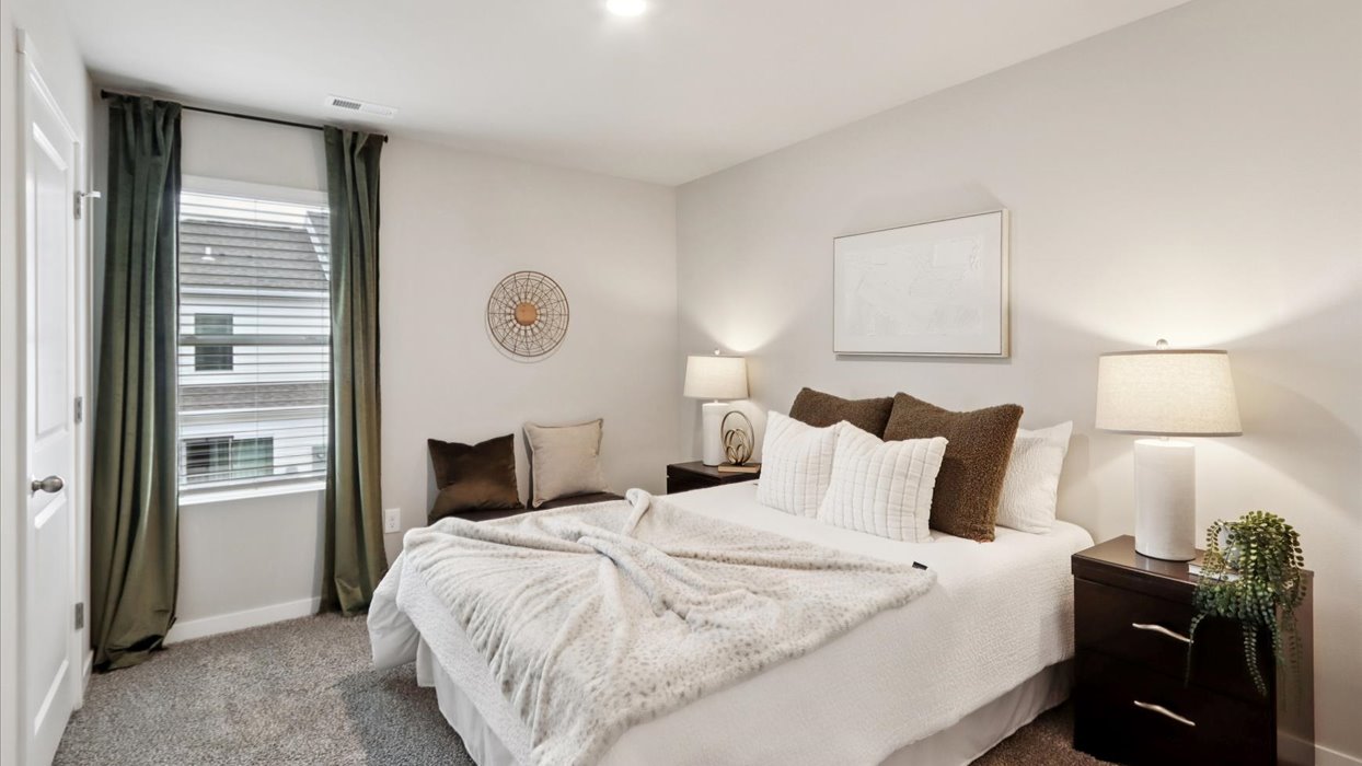 Comfortable secondary bedroom with natural light, modern finishes, and versatile living space.