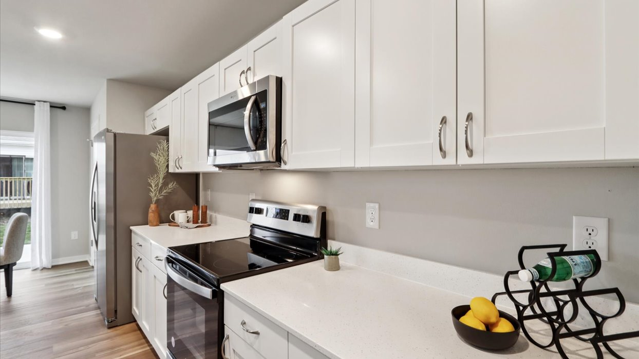 Kitchen with white cabinetry and quartz countertop