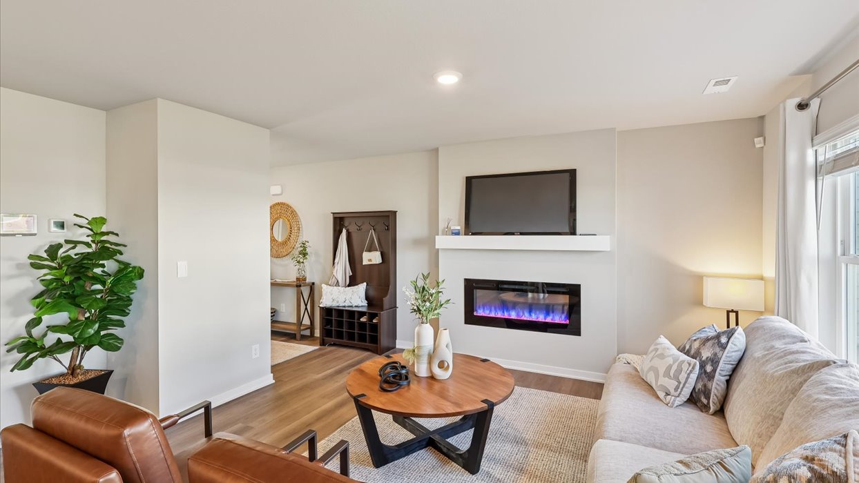 Open concept living room with electric fireplace