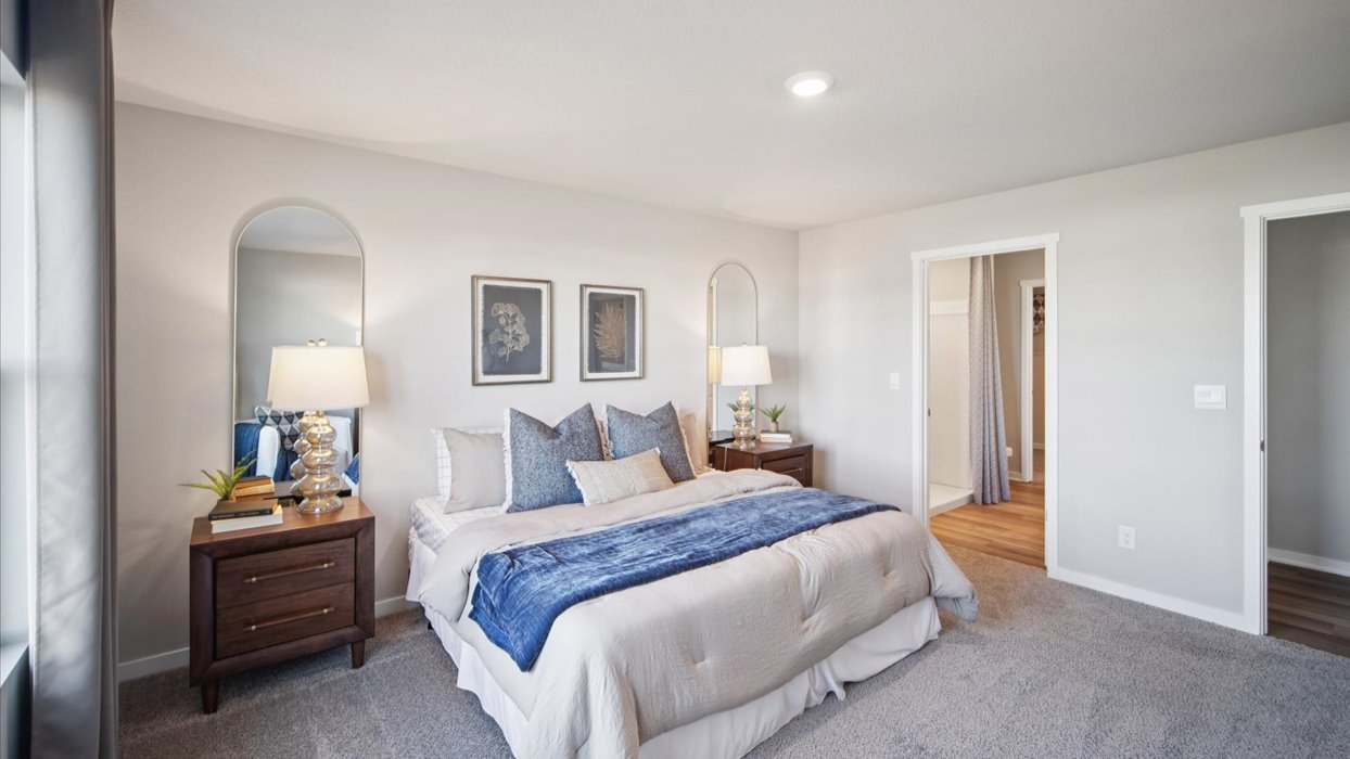 Primary bedroom with natural lighting and spacious layout