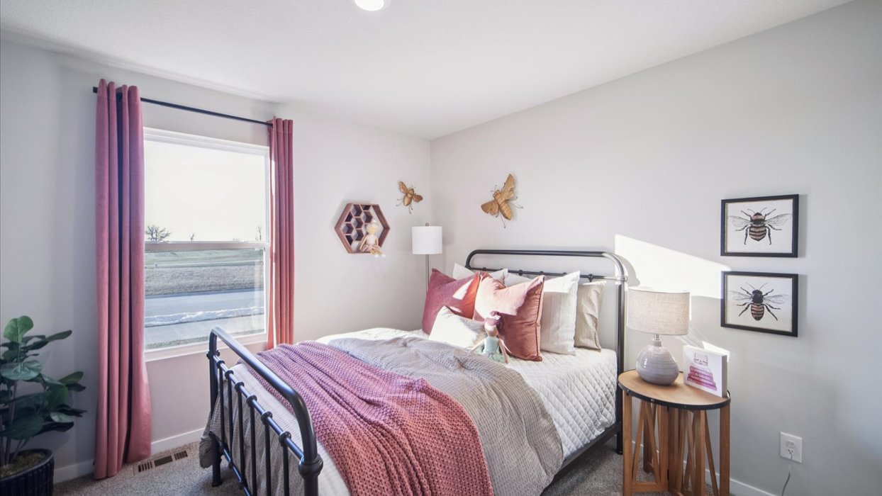 Comfortable secondary bedroom with natural light, modern finishes, and versatile living space.