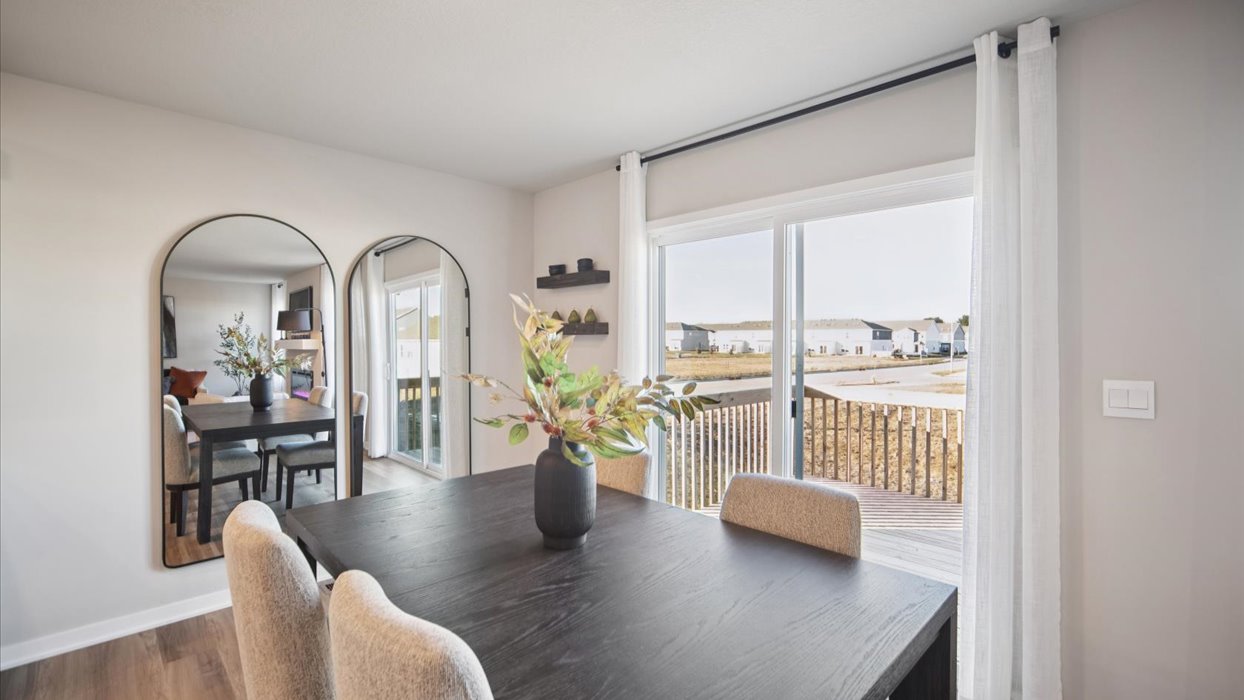 Open concept dining space with access to backyard