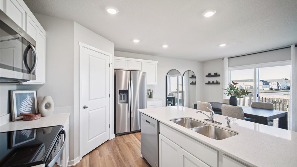 Kitchen with white cabinetry and quartz countertop