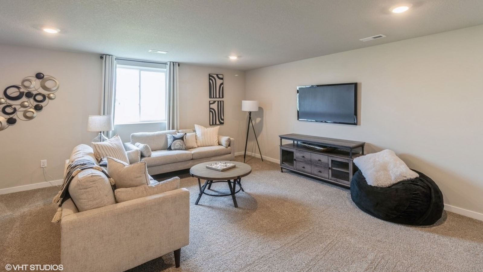Finished basement living area with comfortable seating space and flexible room for entertaining or relaxing.