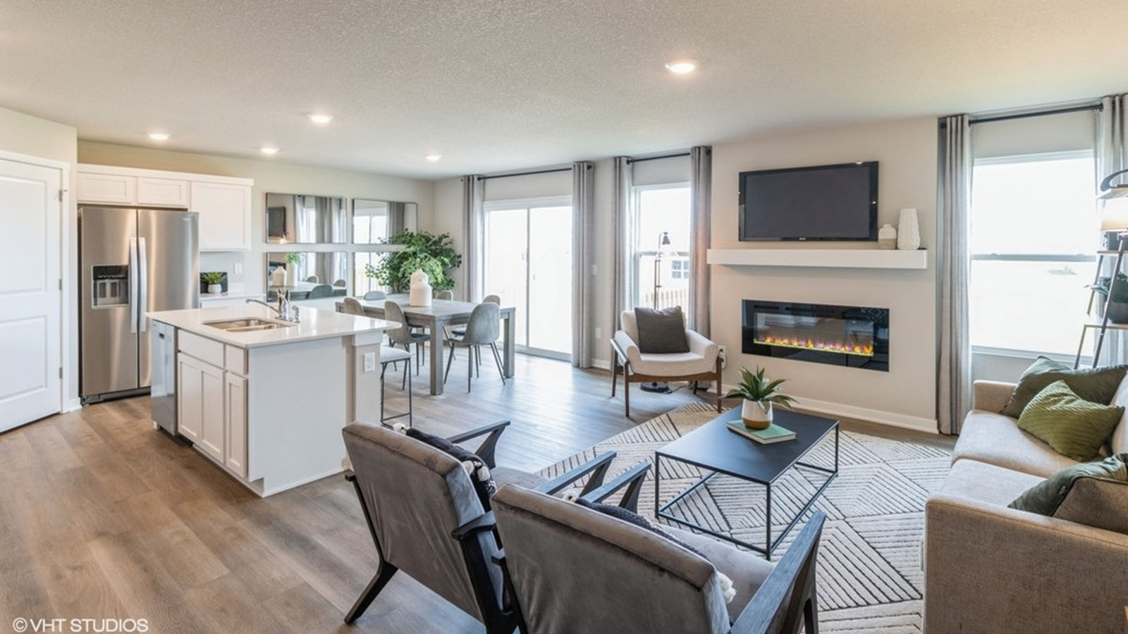 Open concept living room with electric fireplace