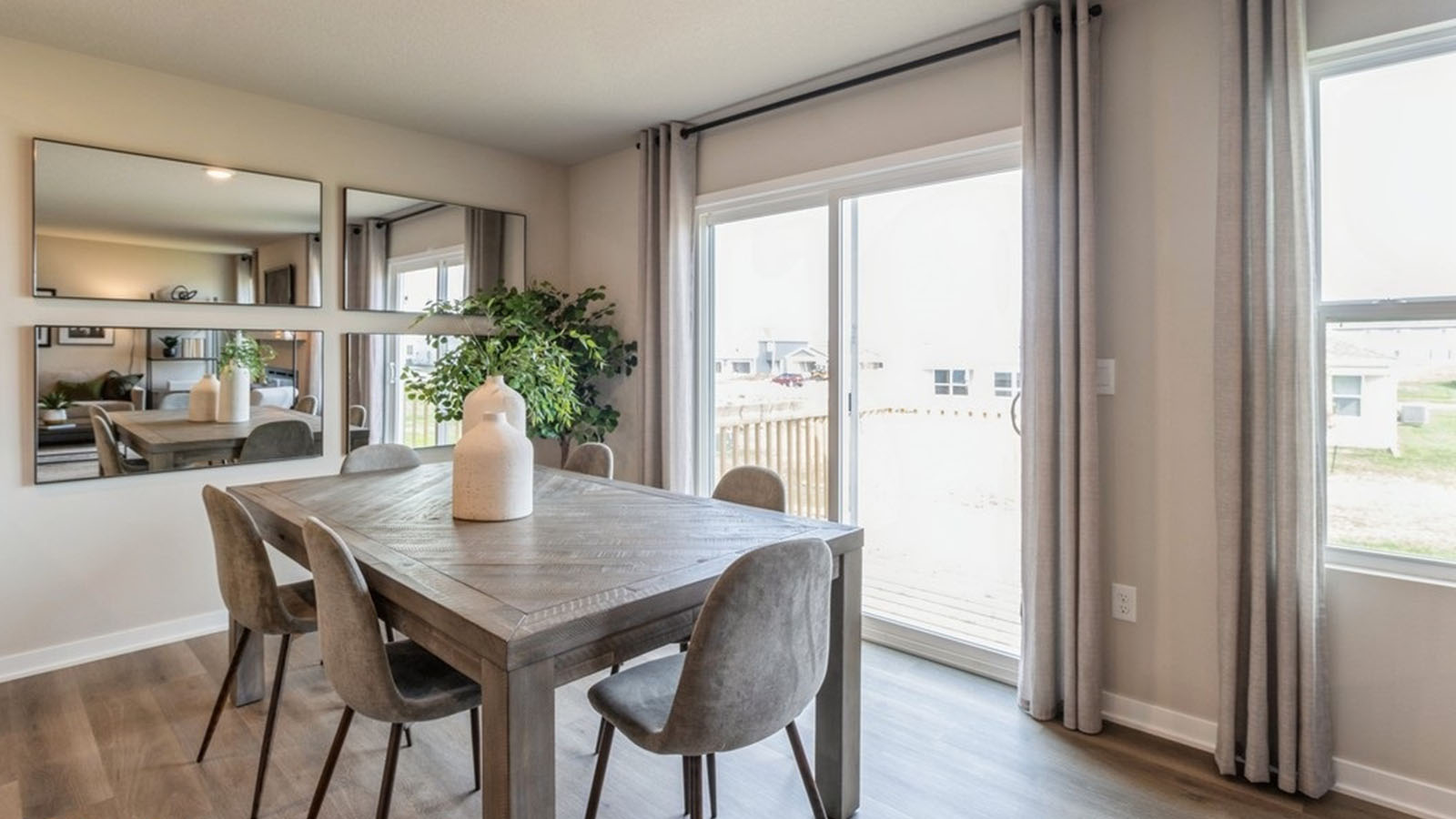 Open concept dining space with access to backyard