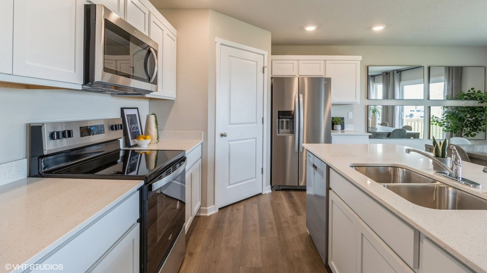 Kitchen with white cabinetry and quartz countertop