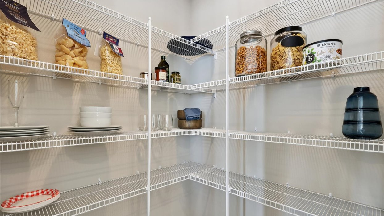 walk-in pantry with white wire shelving
