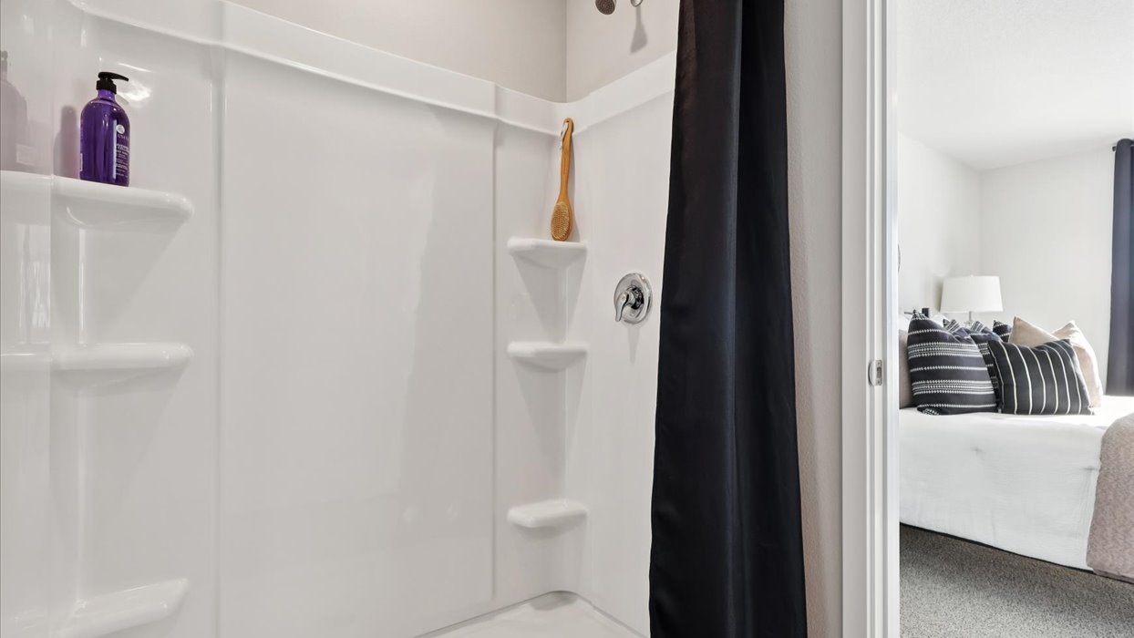 walk-in shower with shelving