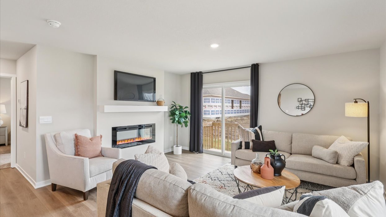 spacious abbott living room with window that floods the room with lots of natural light
