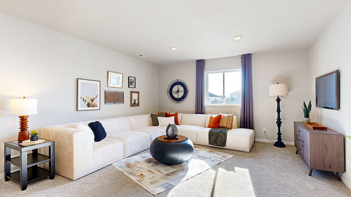 Finished basement living area with comfortable seating space and flexible room for entertaining or relaxing.