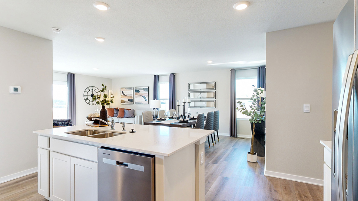 Kitchen with white cabinetry and quartz countertop