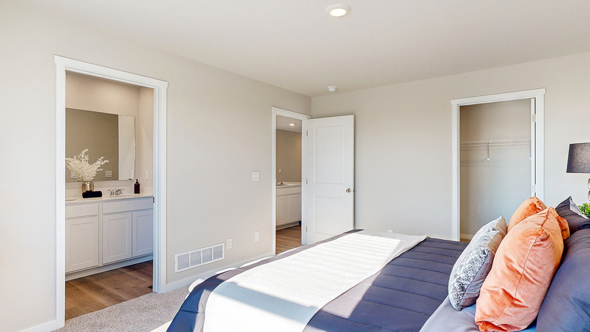 Primary bedroom with natural lighting and spacious layout