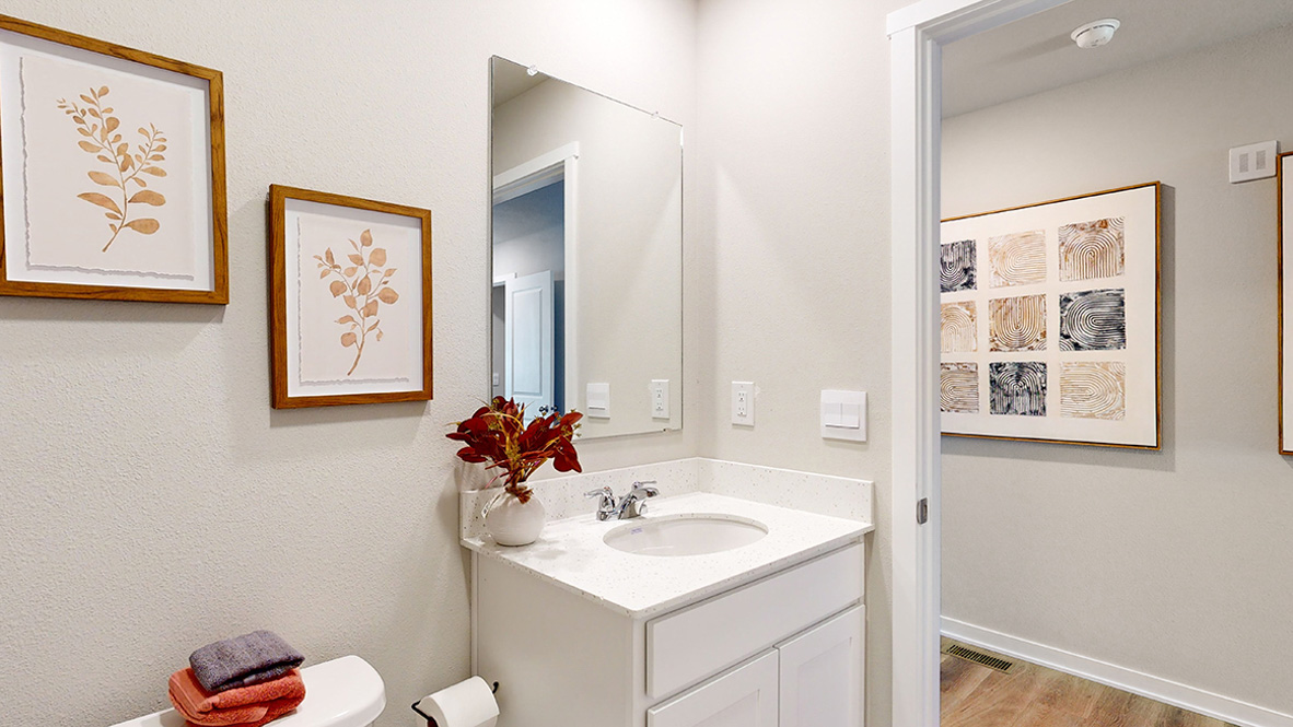 Stylish full bathroom with bright lighting and functional design.