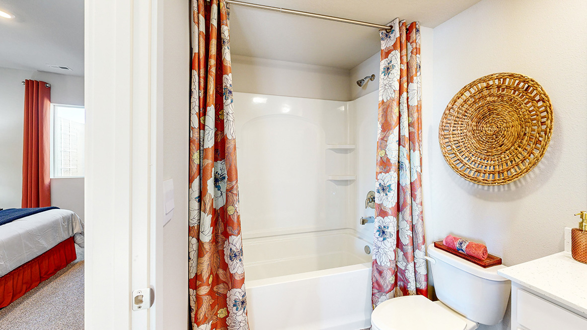 Stylish lower-level bathroom featuring contemporary fixtures and convenient access from the finished basement.