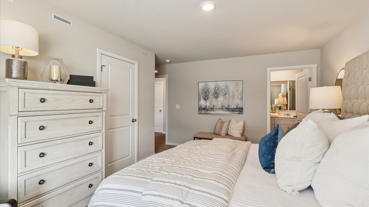Primary bedroom with natural lighting and spacious layout