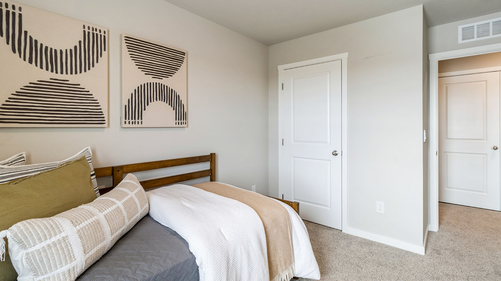 Comfortable secondary bedroom with natural light, modern finishes, and versatile living space.