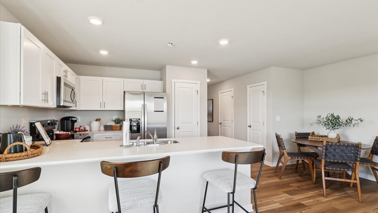Kitchen with white cabinetry and quartz countertop