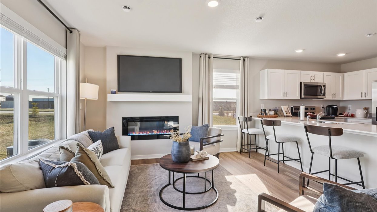 Open concept living room with electric fireplace