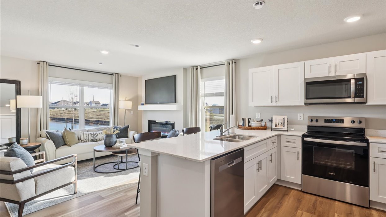 Kitchen with white cabinetry and quartz countertop