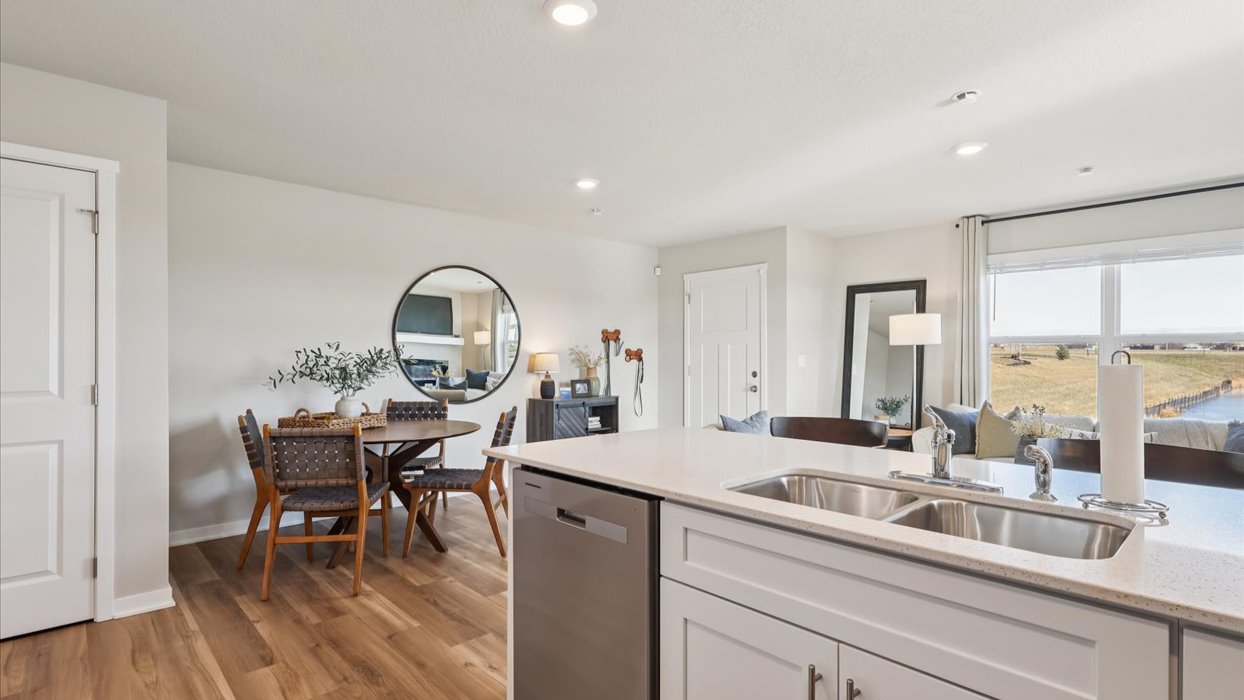 Kitchen with white cabinetry and quartz countertop
