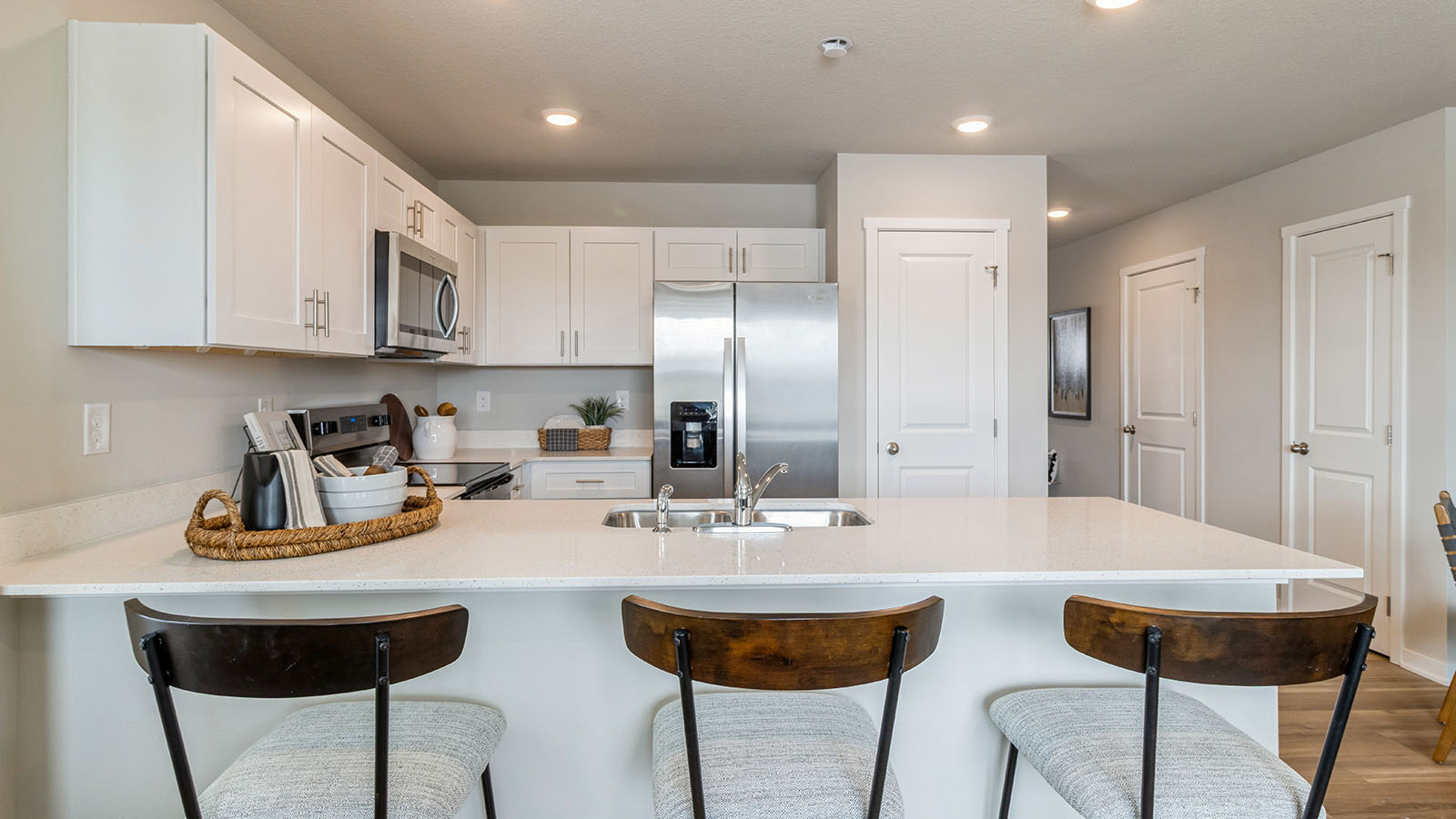 Kitchen with white cabinetry and quartz countertop