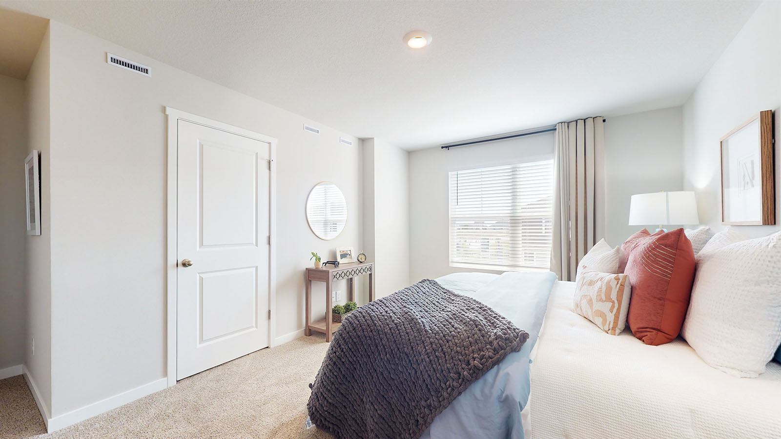 Primary bedroom with natural lighting and spacious layout