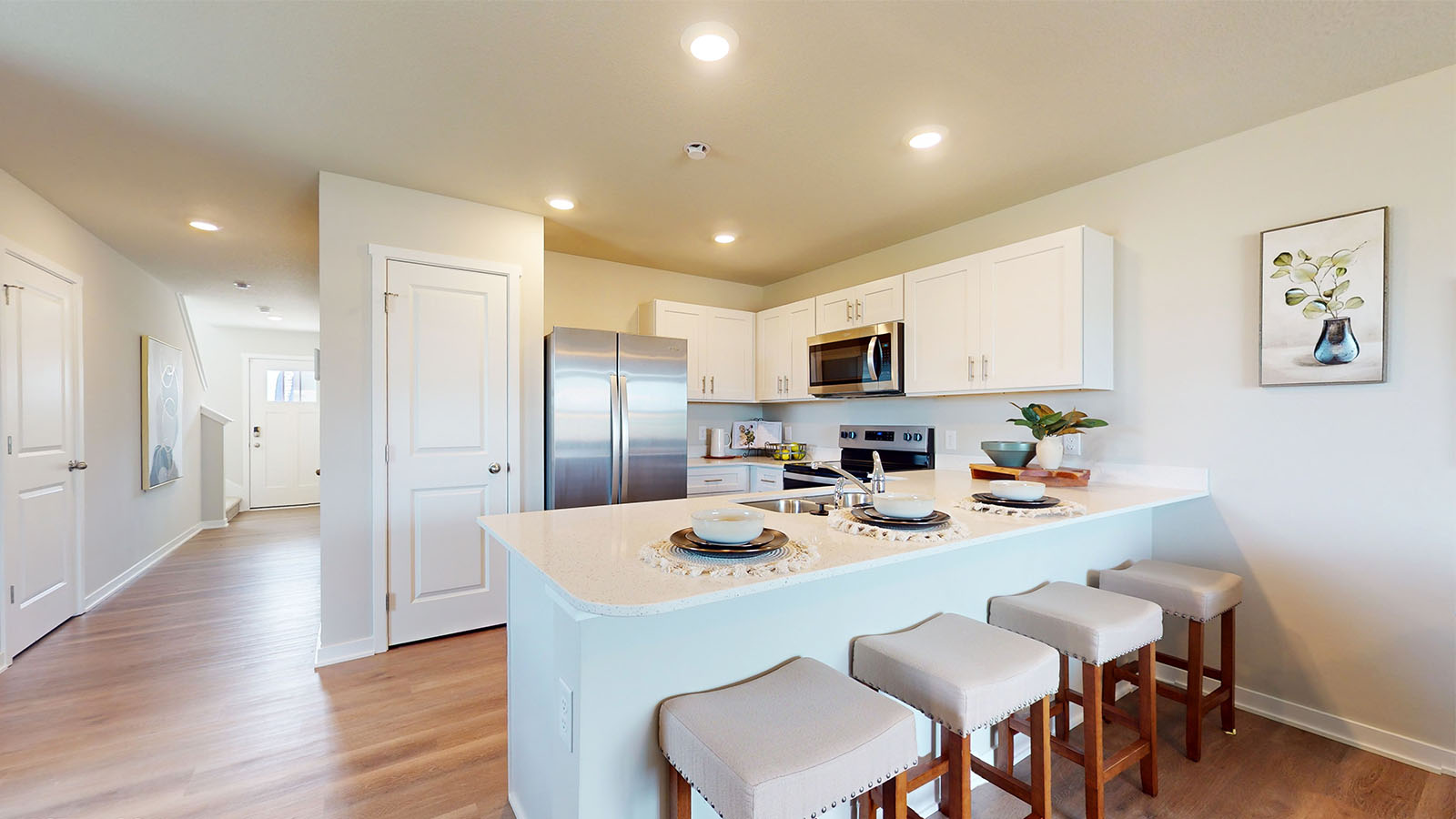 Kitchen with white cabinetry and quartz countertop