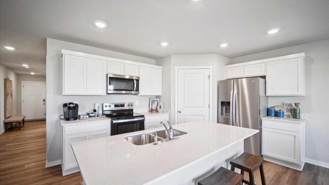 modern white kitchen with stainless-steel appliances