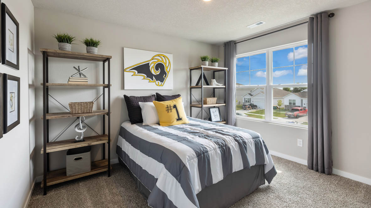 Comfortable secondary bedroom with natural light, modern finishes, and versatile living space.