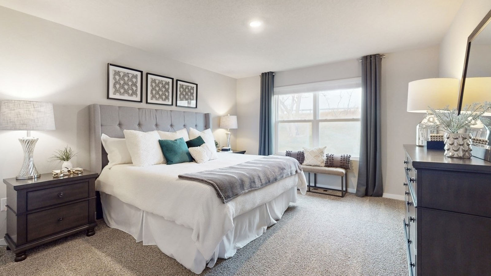 Primary bedroom with natural lighting and spacious layout