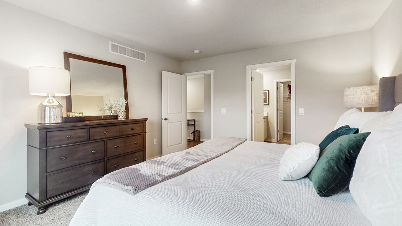 Primary bedroom with natural lighting and spacious layout