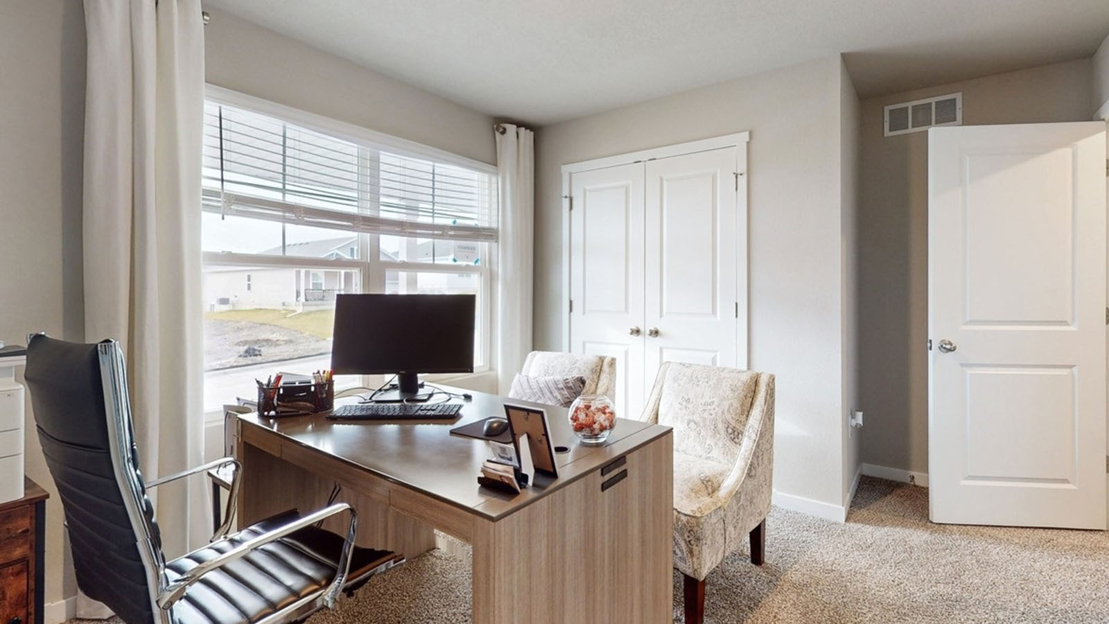 Comfortable secondary bedroom with natural light, modern finishes, and versatile living space.
