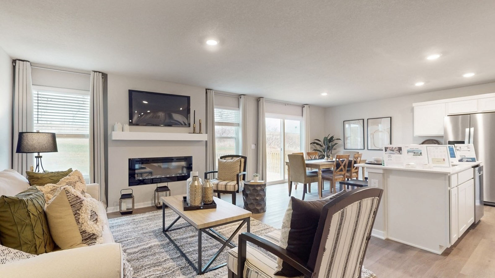 Open concept living room with electric fireplace