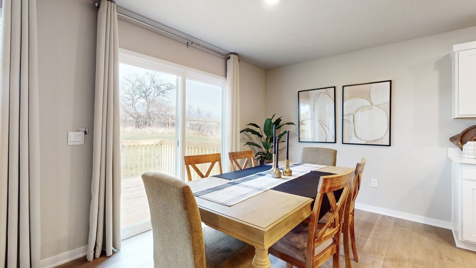 Open concept dining space with access to backyard