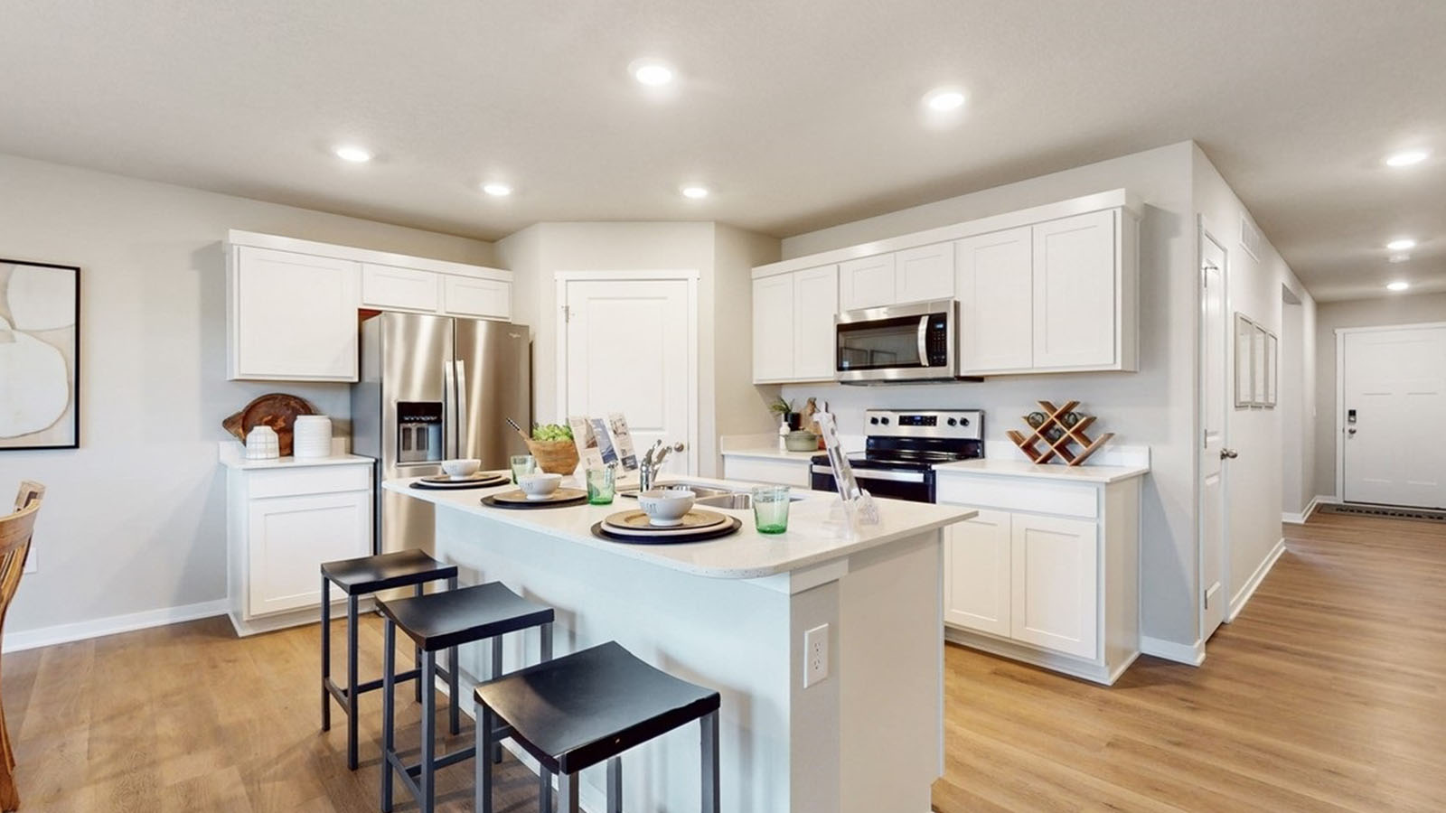 Kitchen with white cabinetry and quartz countertop
