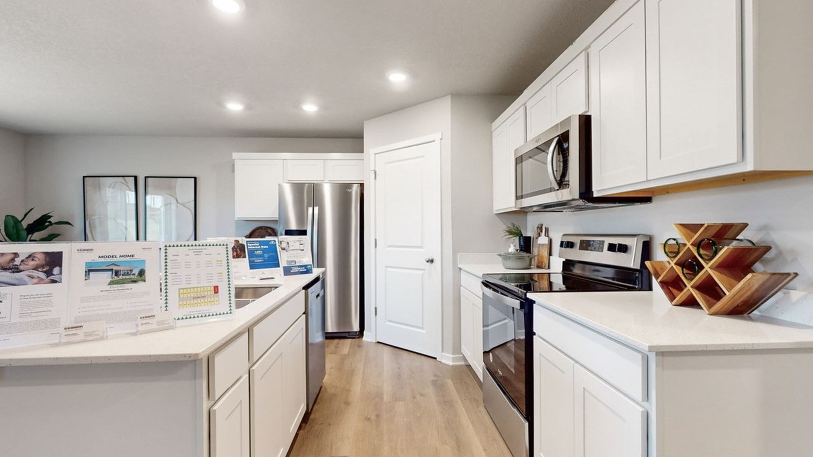 Kitchen with white cabinetry and quartz countertop